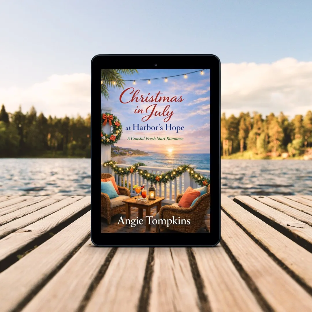 Christmas in July at Harbor's Hope by Angie Tompkins displayed on a tablet beside a lake